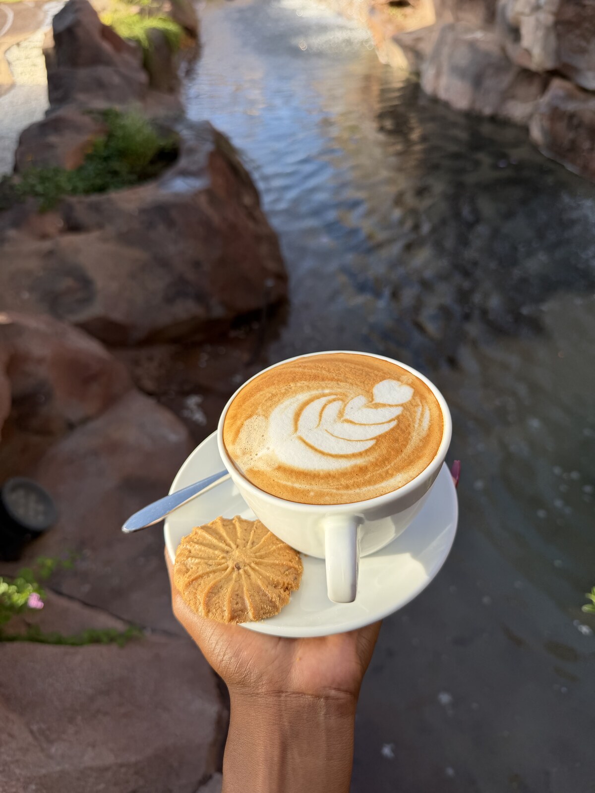 Café latte with barista art served at the Mawimbi Jiko coffee house