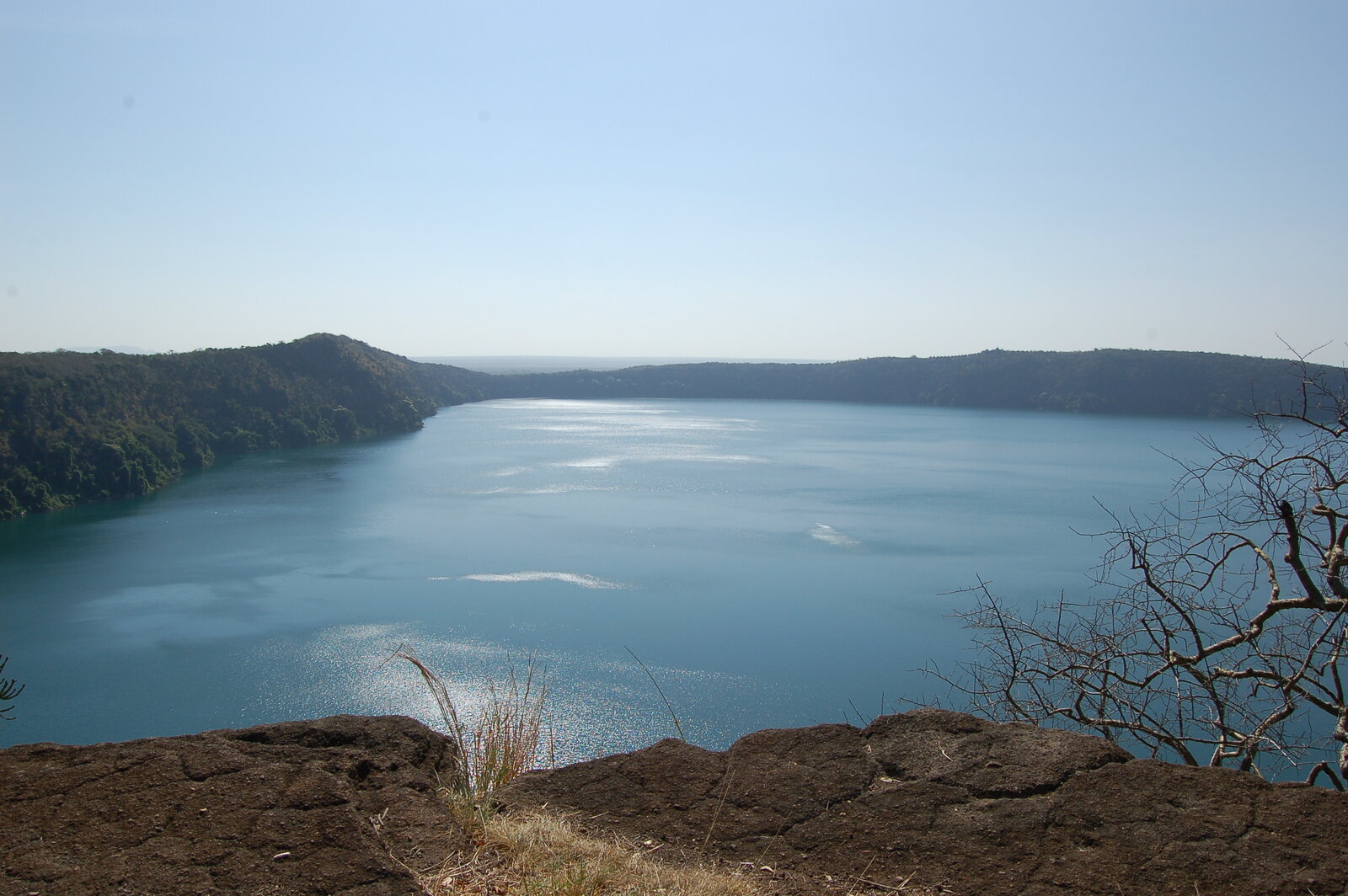 Lake Chala crater lake near Taveta, framed by green escarpment slopes